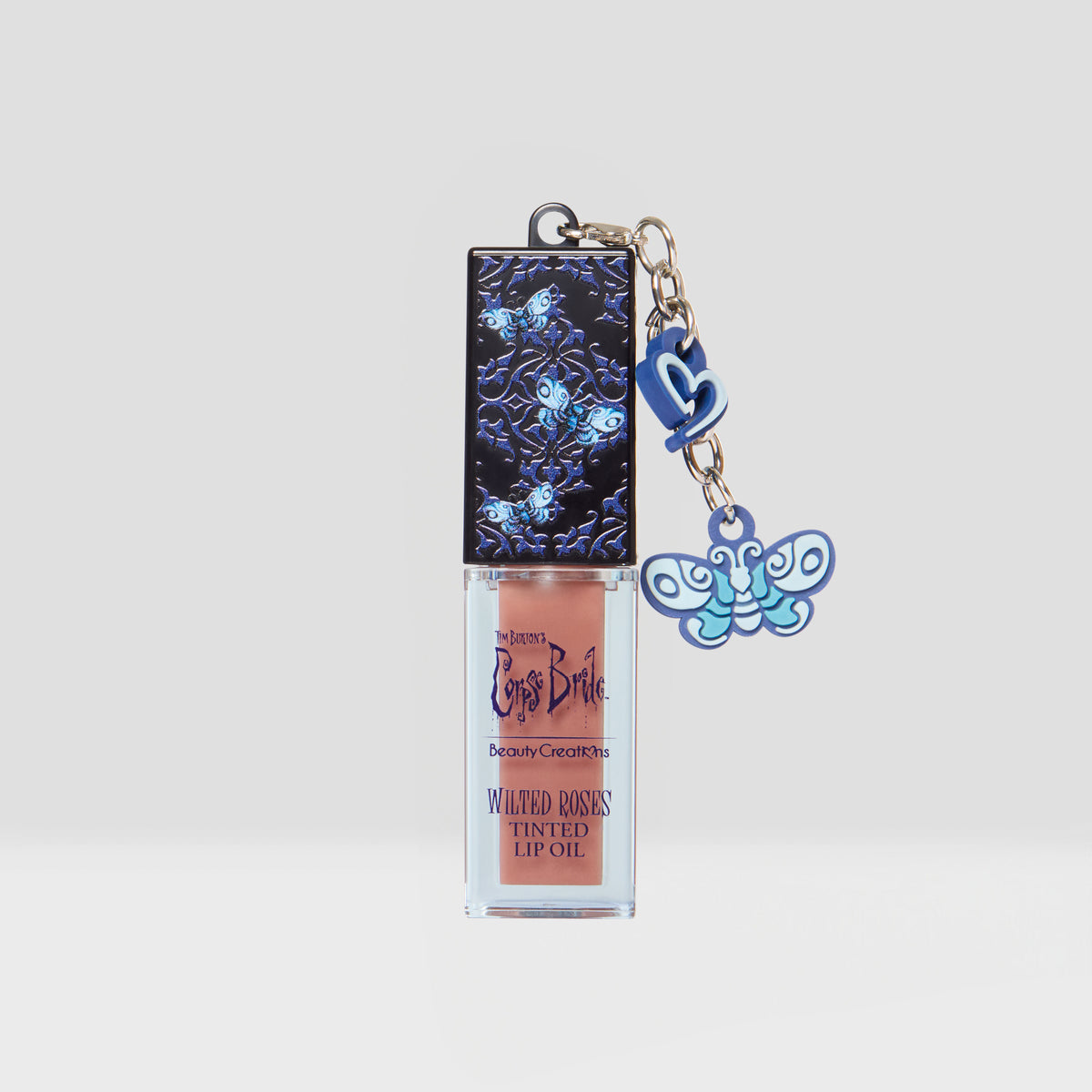 CORPSE BRIDE TINTED LIP OIL VANILLA ROSE WILTED ROSES - BEAUTY CREATIONS X TIM BURTONS